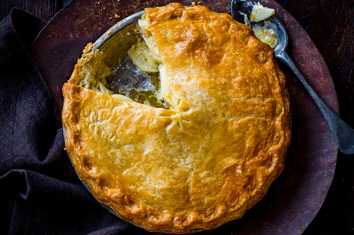 Apple and clotted cream pie with a slice taken out