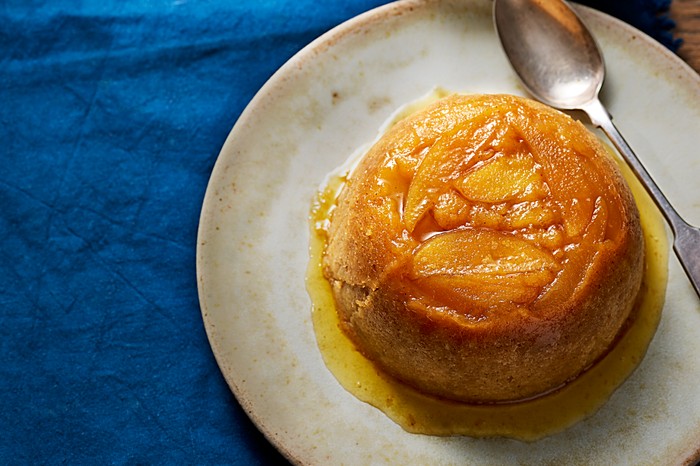 A steamed apple sponge on a plate