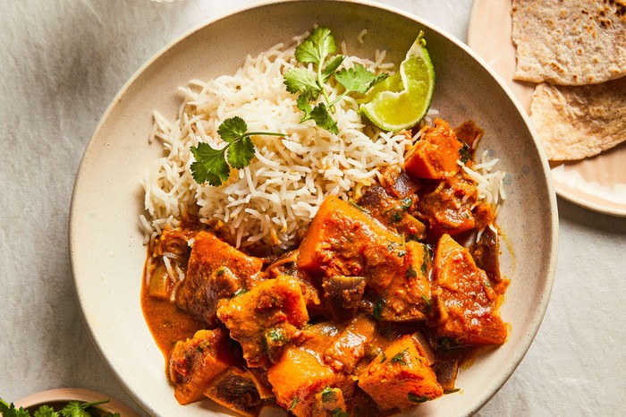 a bowl of butternut squash curry with rice