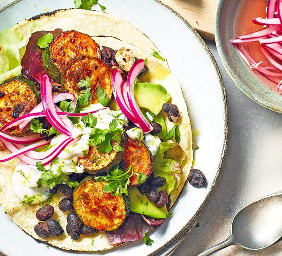 Taco Topped with Sliced Charred Courgette, Black Beans and Red Onion