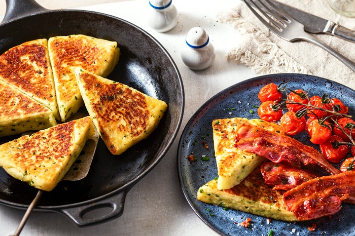 A frying pan with potato scones in it